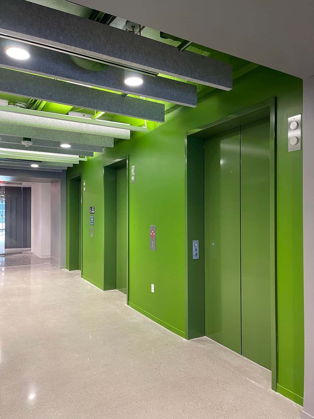 Interior commercial painting: elevator lobby painted green