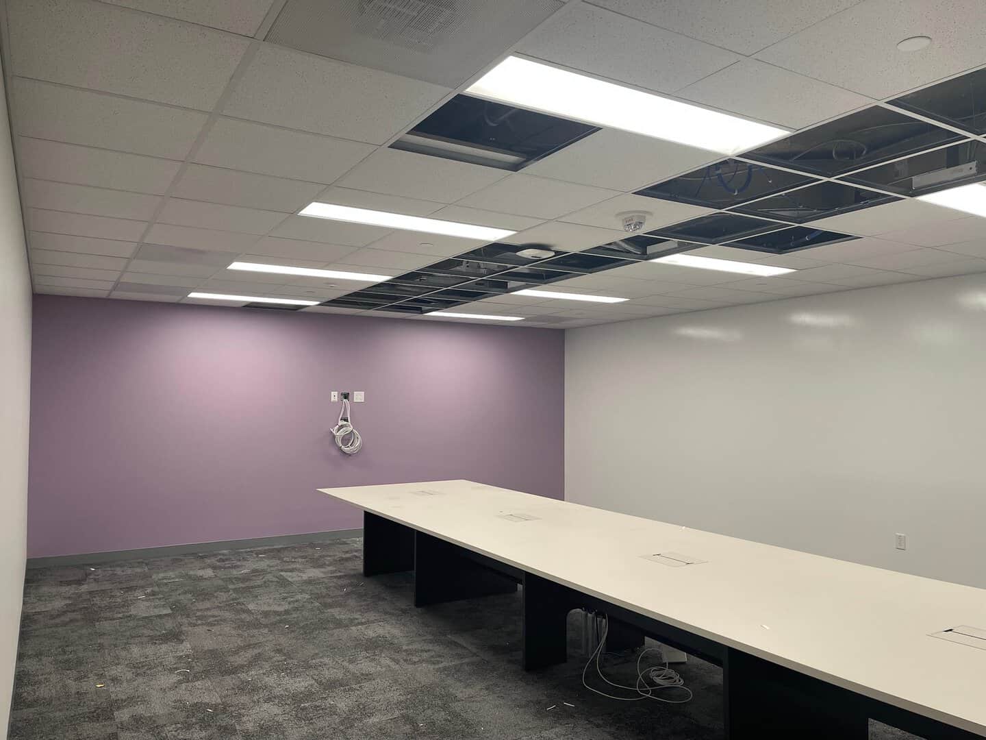 Interior commercial painting: conference room with lavender wall