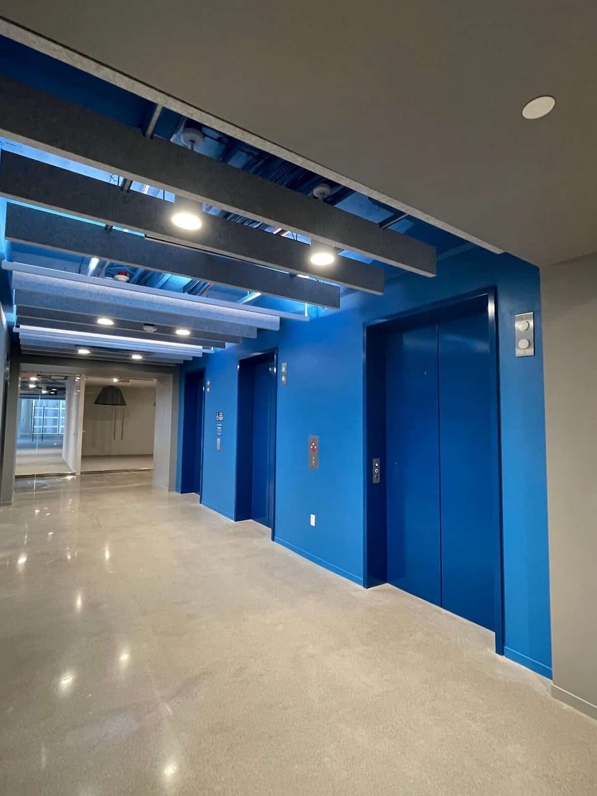 Interior commercial painting: elevator lobby painted blue
