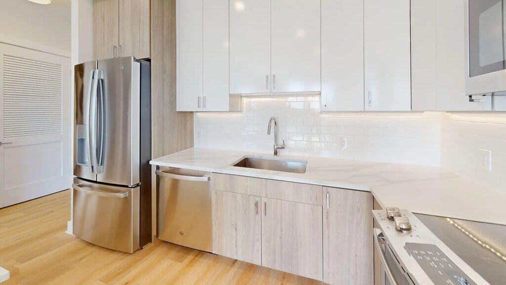 Apartment kitchen with freshly painted walls and cabinetry
