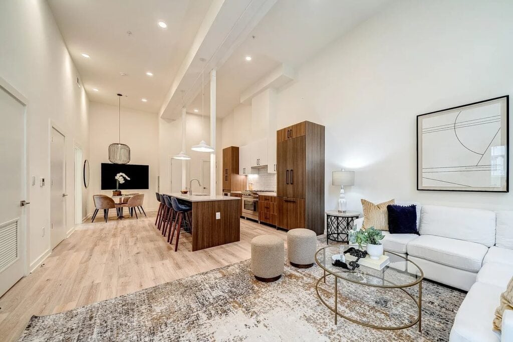 Bright open-plan living room with freshly painted white walls
