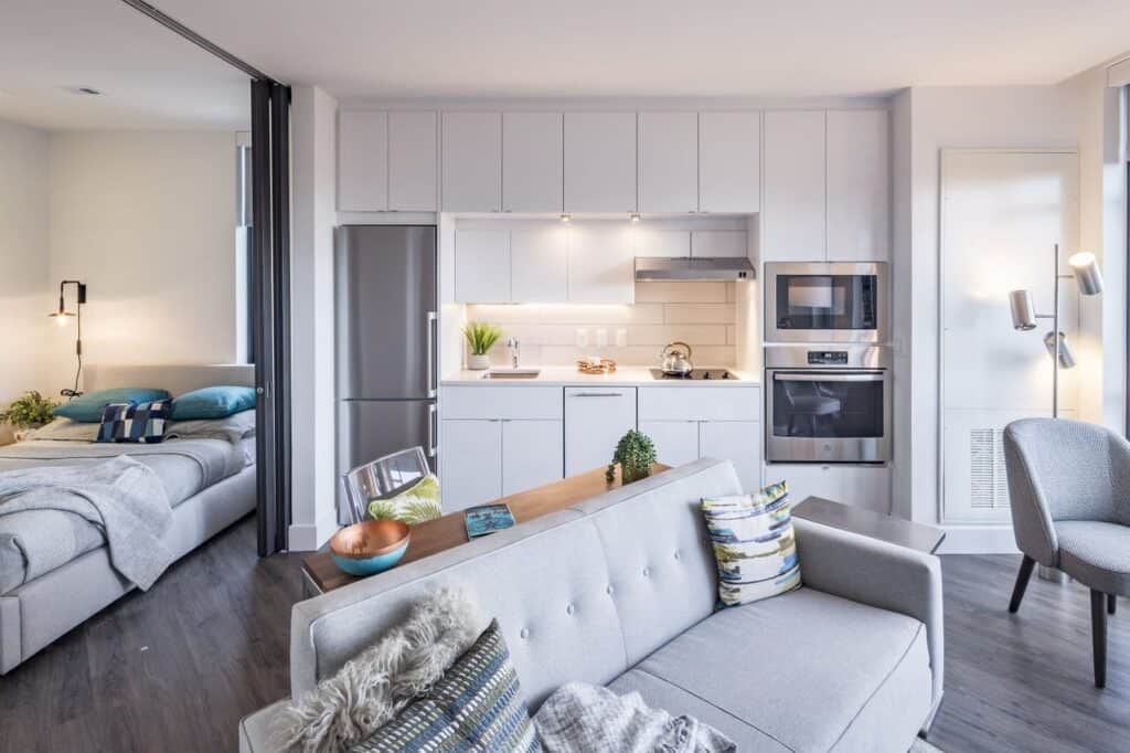 Interior painting in a studio apartment with clean white walls