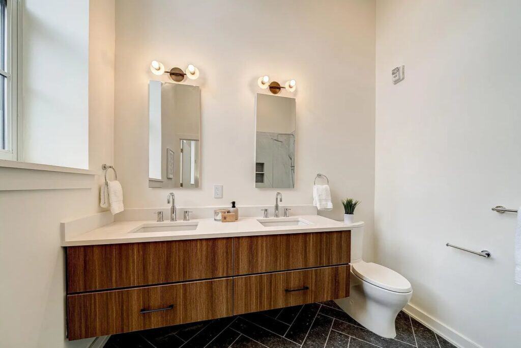 Freshly painted bathroom with wood vanity