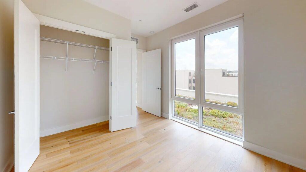 Freshly painted empty bedroom with a double closet