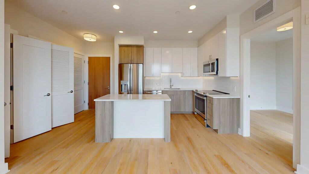 Open kitchen and living area with fresh paint